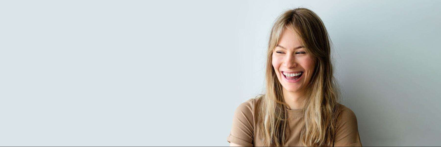 Portrait of a patient with ceramic orthodontic braces, representing clinical alignment options at our Bondi Junction practice