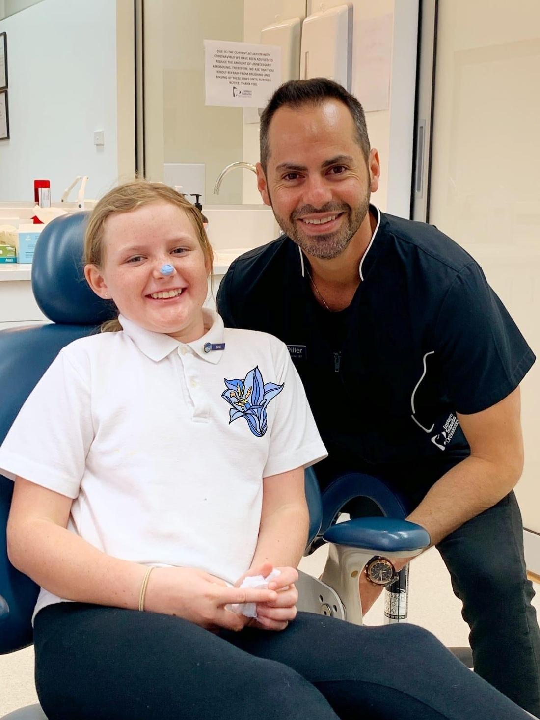 Dr Piller with one of our young patients 